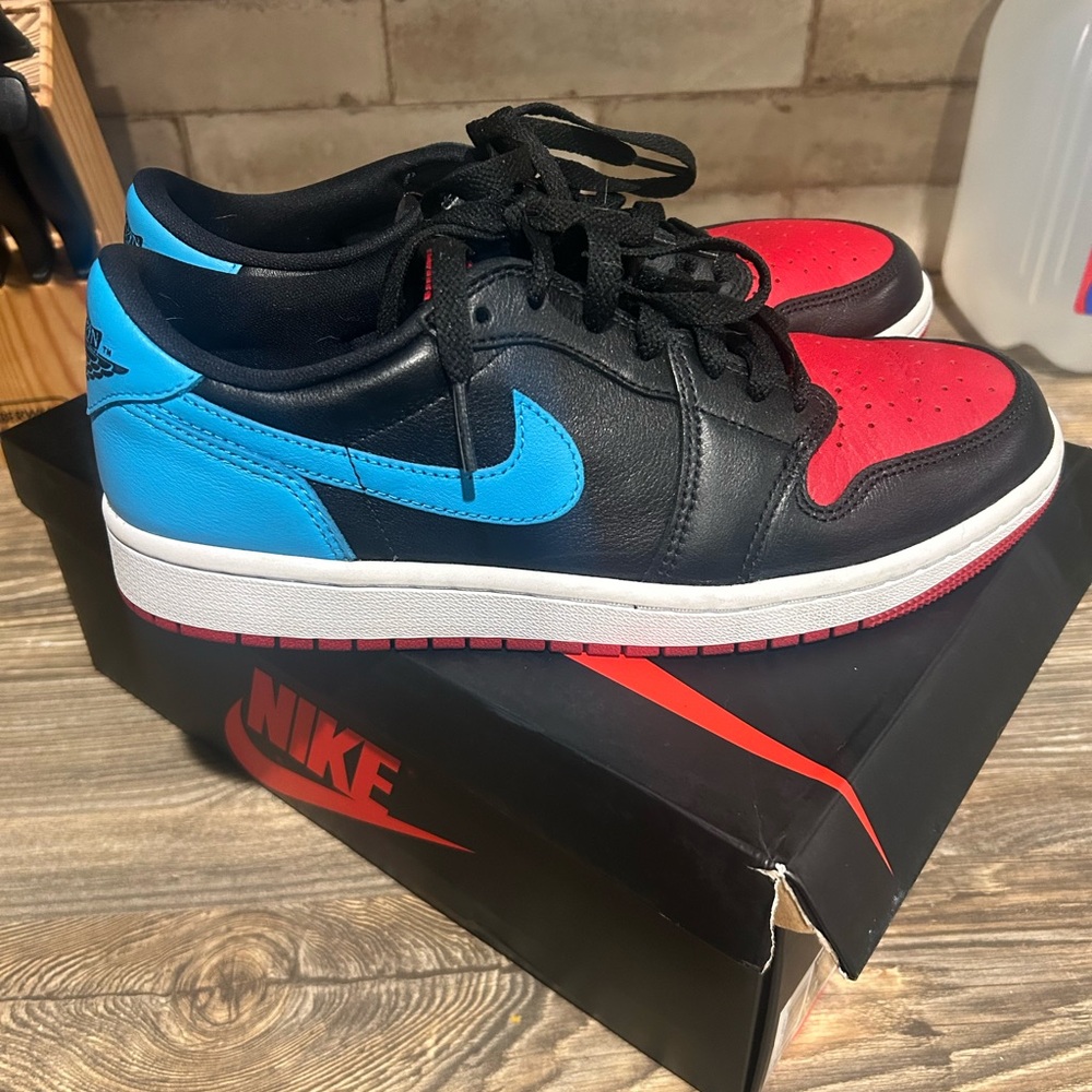 Nike women’s Jordan 1 Retro Low OG Nc to Chi Sneakers in Black, Red, and Blue